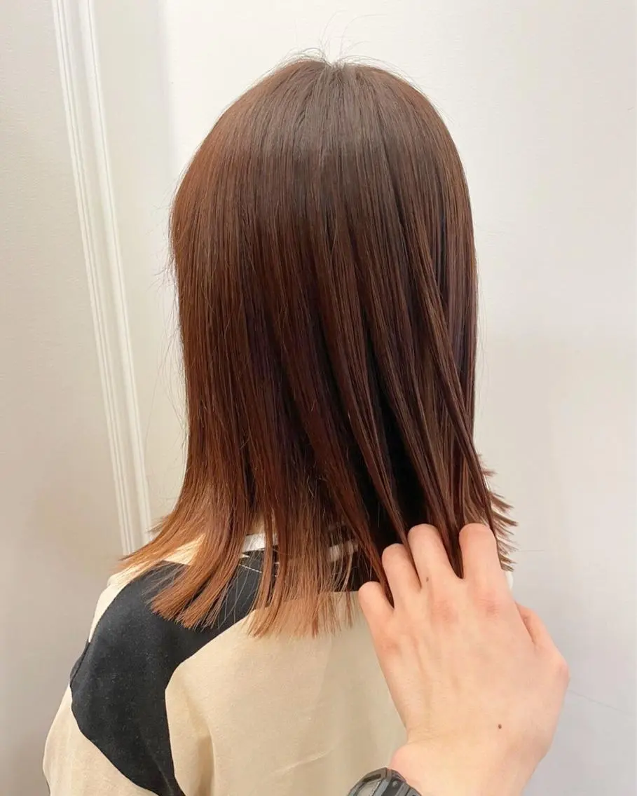 カラー オレンジ ヘアカラー 波巻きウェーブ 韓国風パーマ 纐纈のヘアスタイル