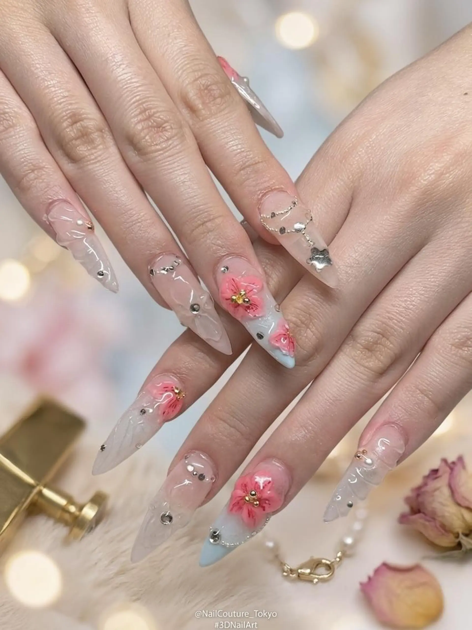 ネイル クリアネイル フラワーネイル 氷ネイル・うるうるネイル キラキラネイル 水色 ハンドネイル UNABOMBA (24時間営業)のネイルデザイン