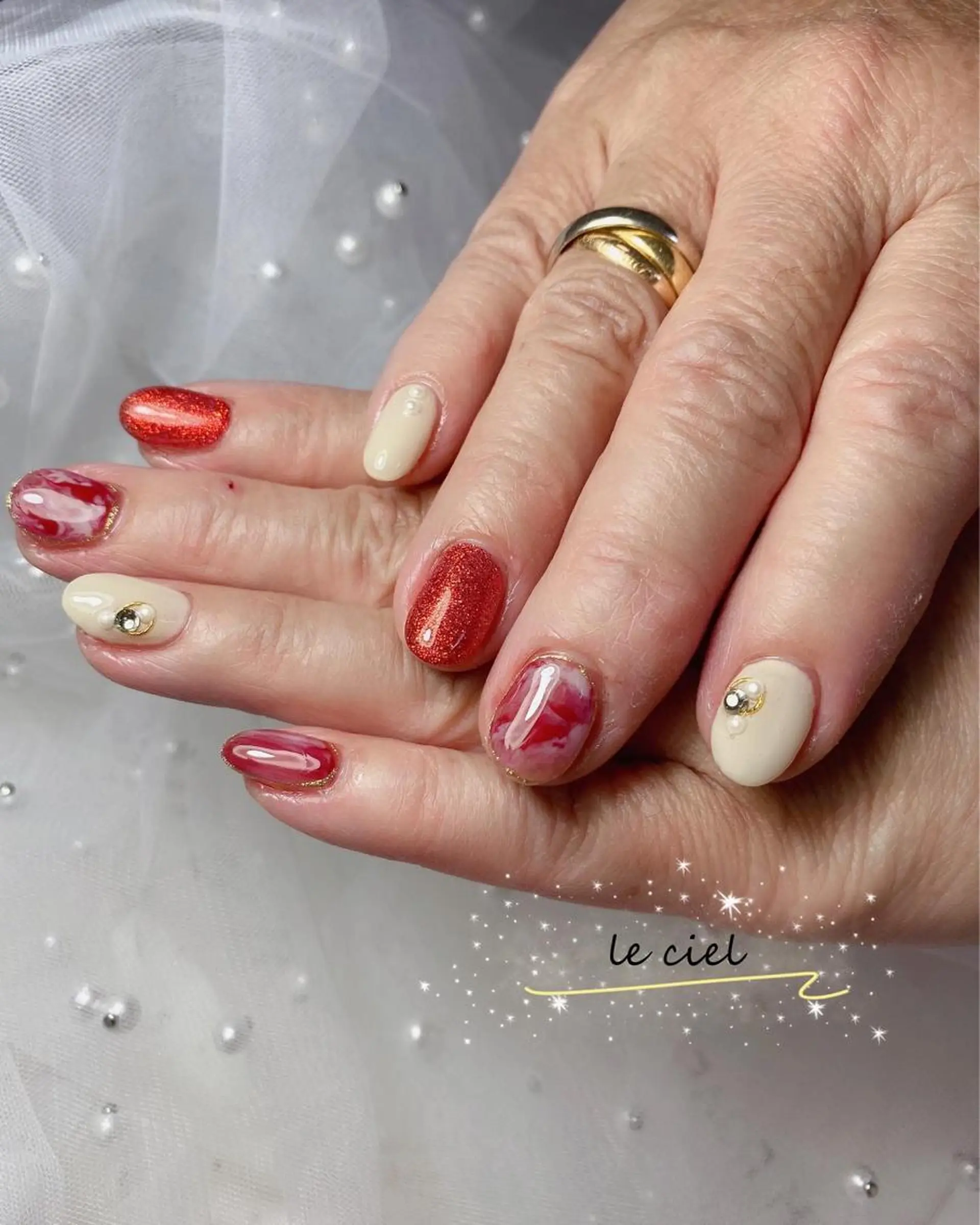ネイル ラメ(グリッター) 大理石ネイル(マーブル) 赤色 冬ネイル Naka Rieのネイルデザイン