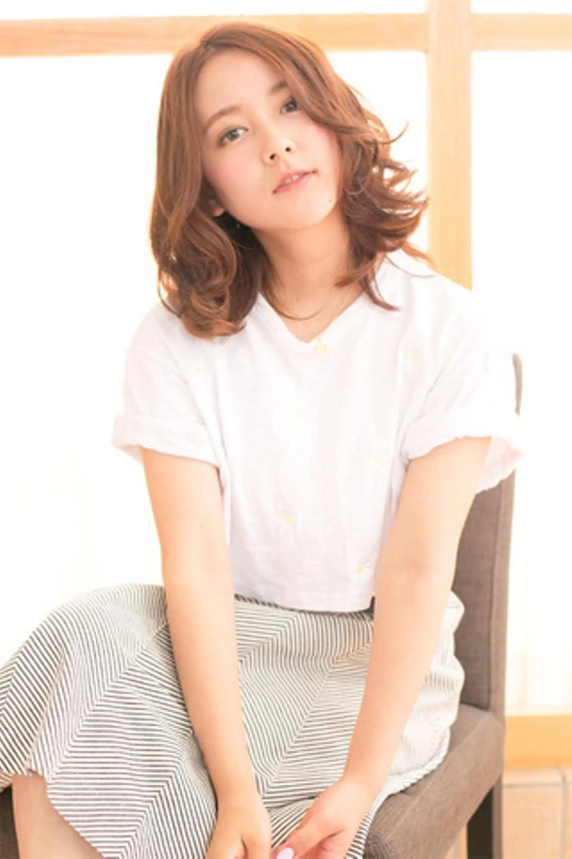 ミディアム ミディアムパーマ ボブ くびれヘア くせ毛 斜めバング Alisha by artinaのヘアスタイル