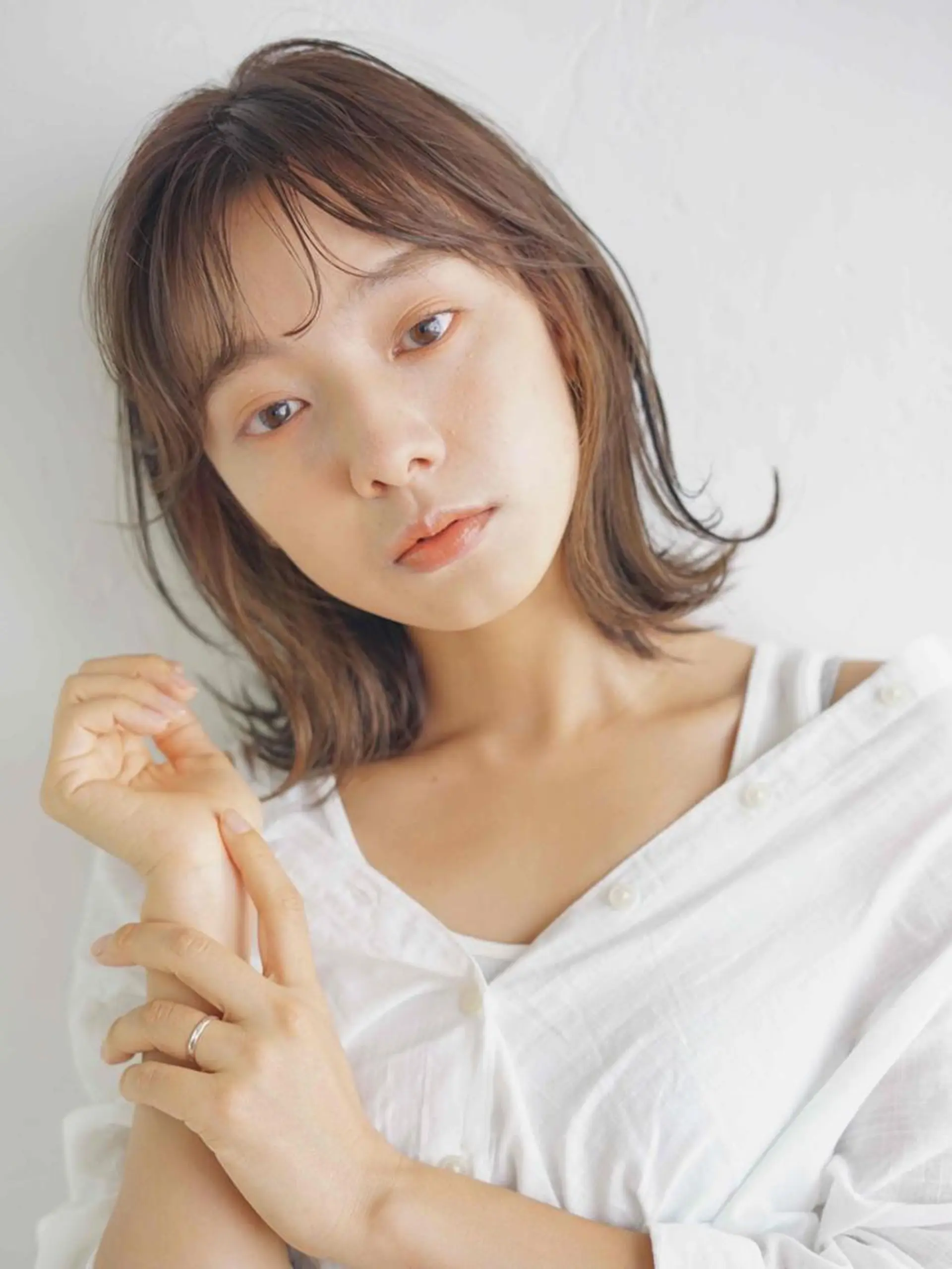 ミディアム カラー ブリーチ デザインカラー イヤリングカラー ハイライトカラー ボブ Neolive plus所属・前田 裕介のヘアスタイル