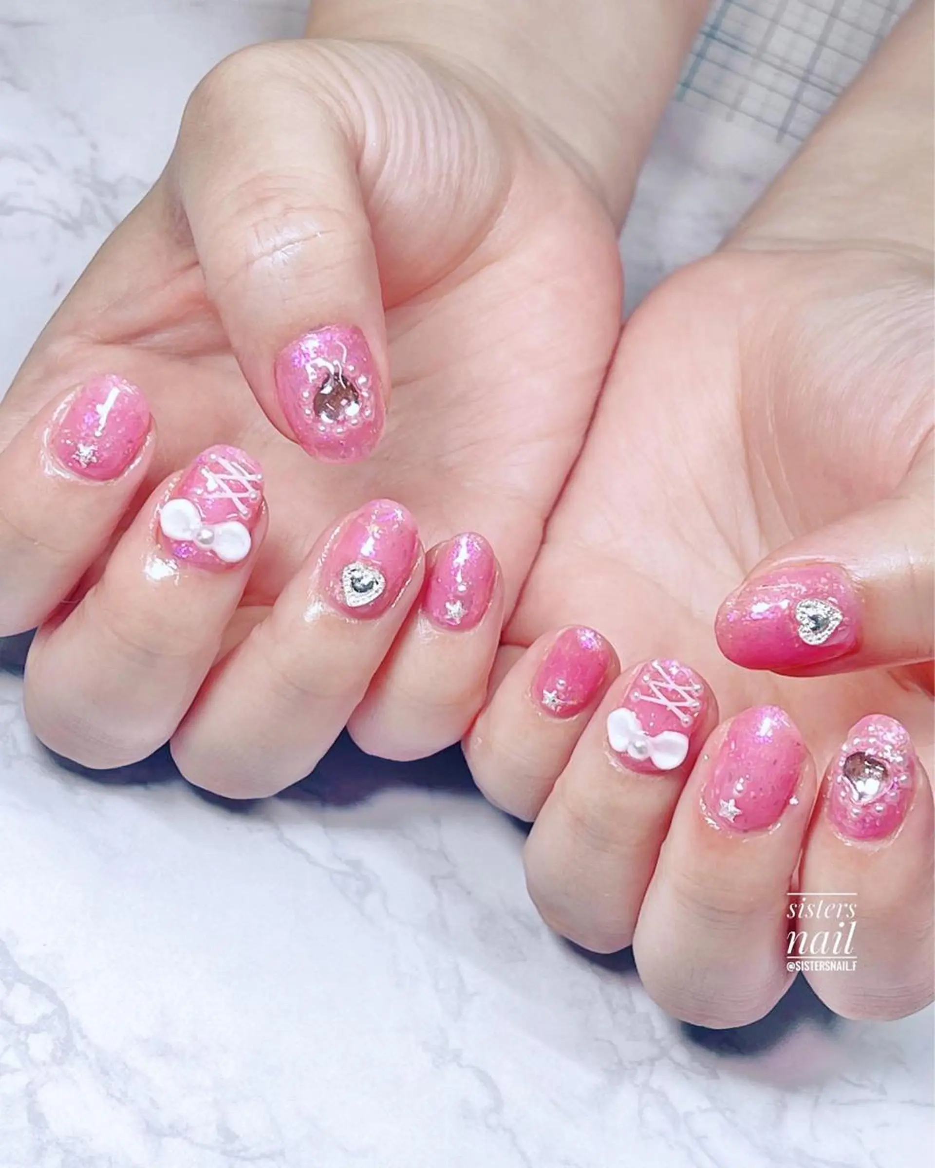 ネイル アートネイル キラキラネイル ピンク リボン シンプルネイル sisters nail.fのネイルデザイン