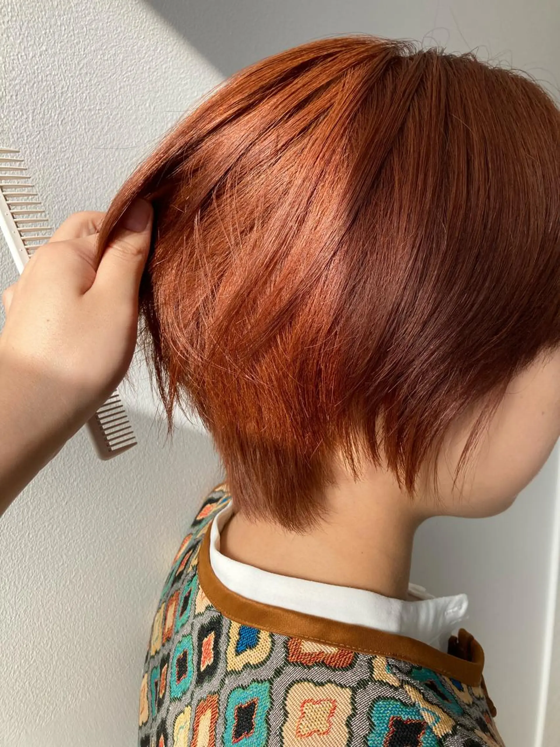 ショート カラー オレンジ nono/パーマ /顔まわりカット🐈のヘアスタイル