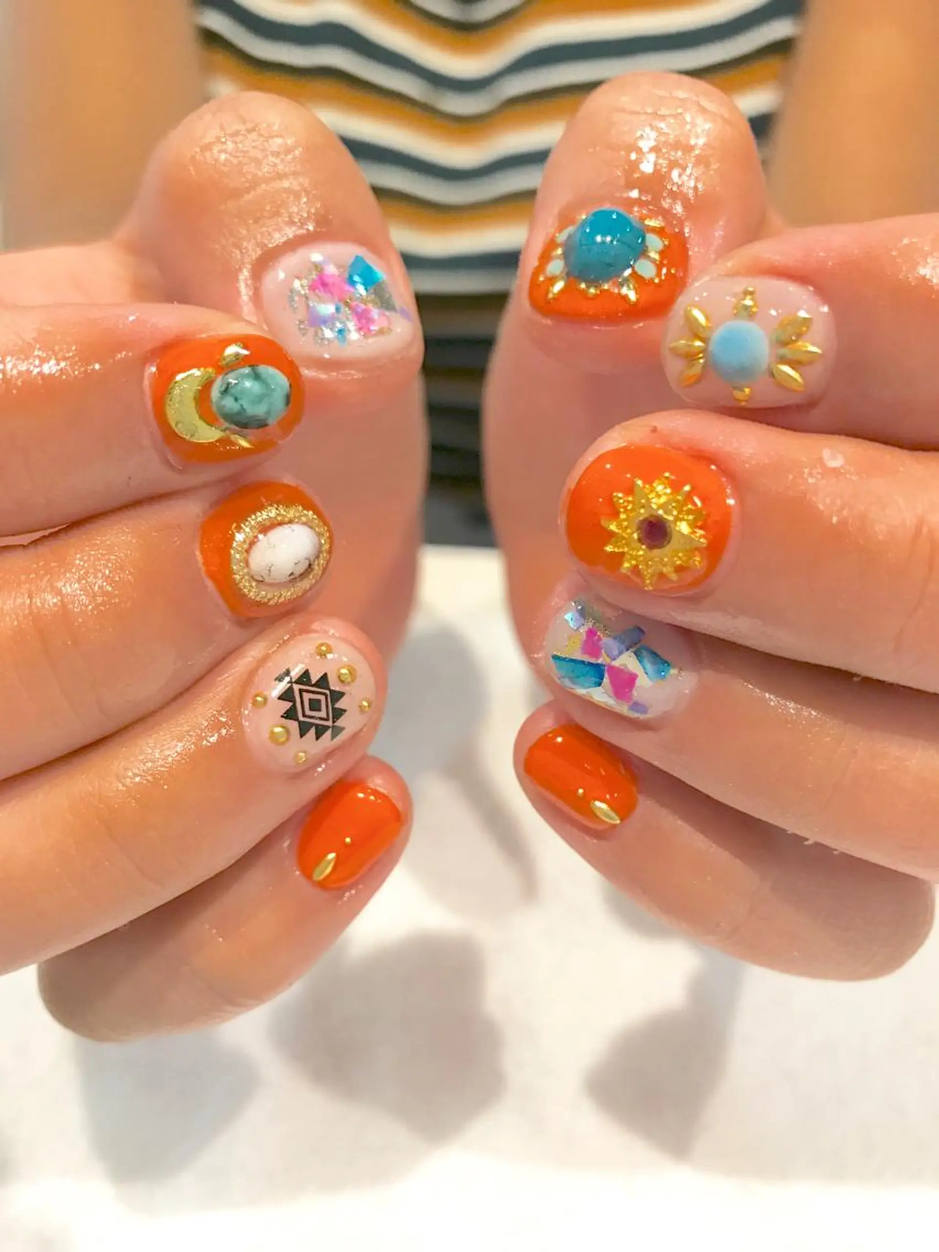 ネイル オレンジ Re Pearl～コーディネートサロン～ 市駅前店所属・NARUMI HYODOのネイルデザイン