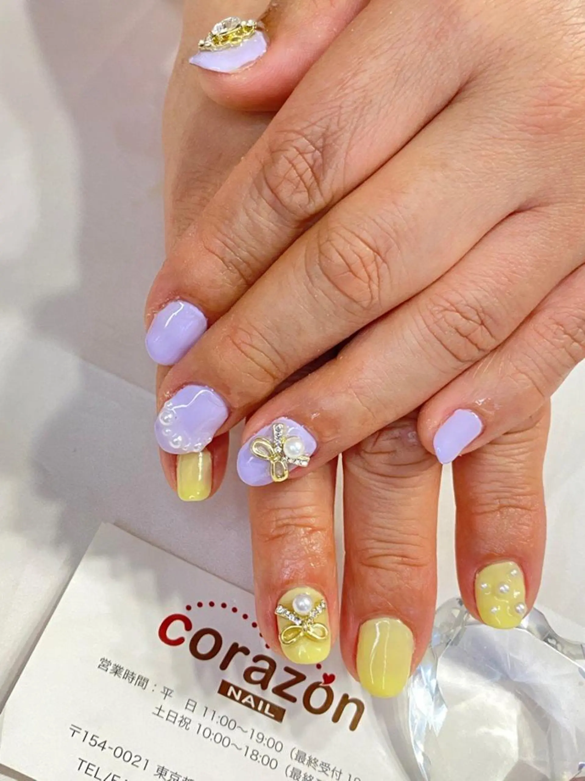 ネイル パステルネイル リボン 黄色 corazon所属・ネイリスト aicoのネイルデザイン