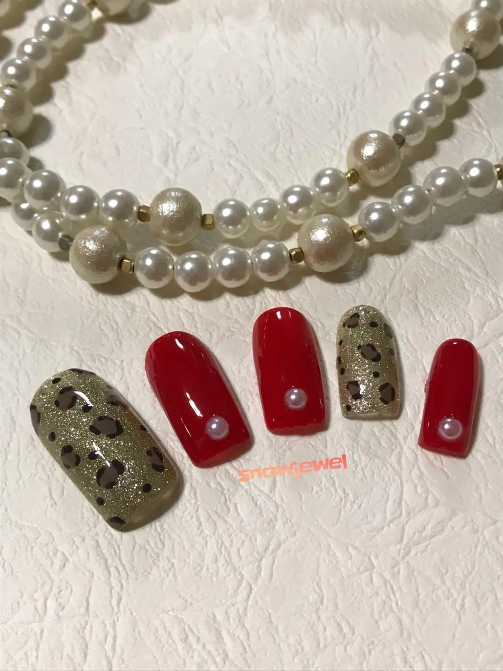 ネイル アニマル柄 フットネイル ゴールド 赤色 nail snowjewelのネイルデザイン