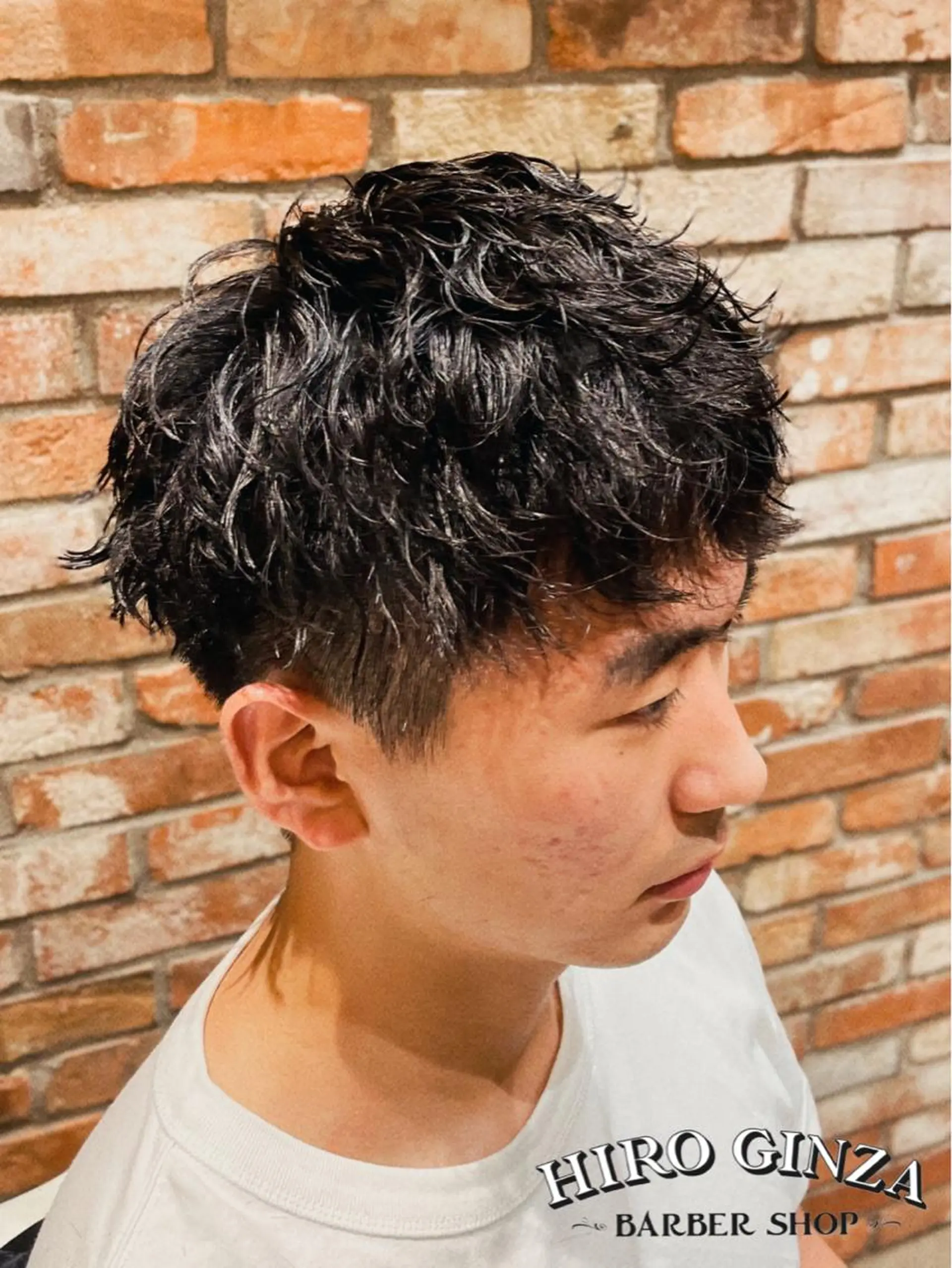 ミディアム パーマ アイブロウ ミディアムパーマ ツイストスパイラルパーマ スパイラルパーマ ヒロ銀座BARBERSHOP丸の内店所属・ヒロ銀座　石川 昂のヘアスタイル