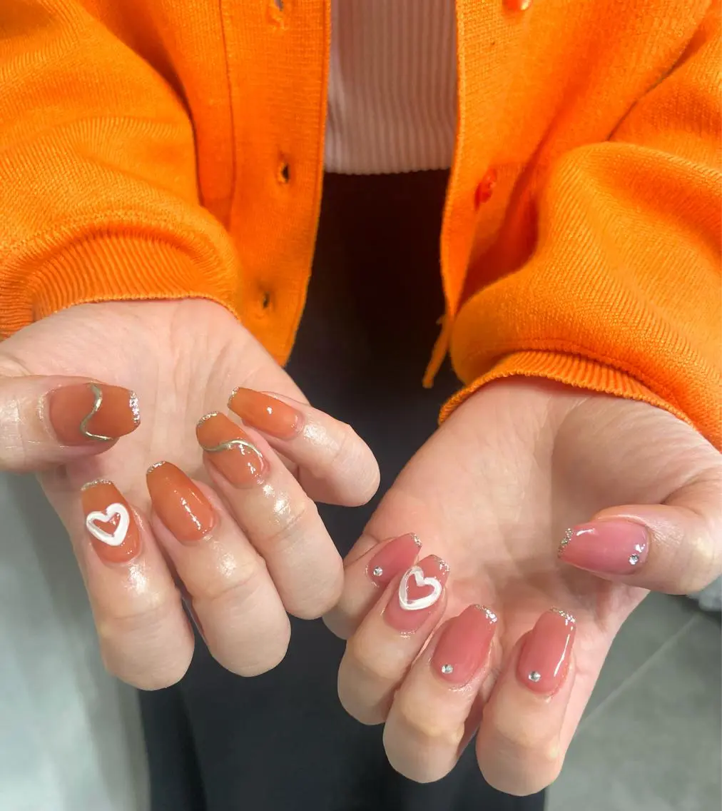 ネイル ハート オレンジ ピンク salon de oct.のネイルデザイン