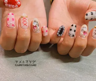 ミディアム ネイル ツメトマツゲ .のネイルデザイン