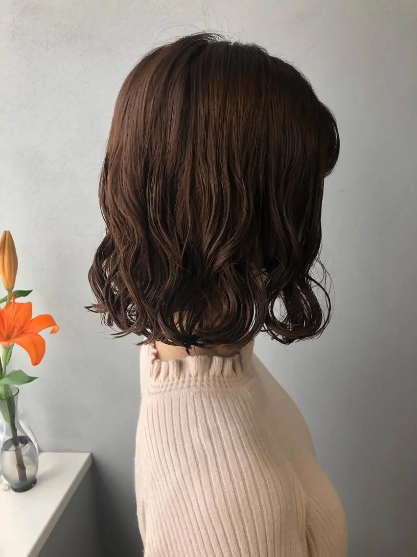 ご新規様メニュー小顔カット＋コテ巻き風パーマの写真