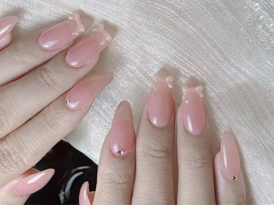 ネイル ワンカラーネイル ピンク リボン ハンドネイル Nail Jolieのネイルデザイン