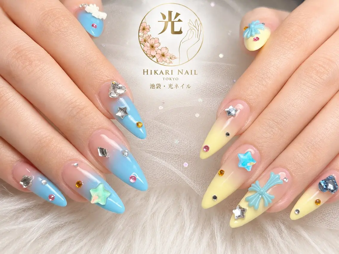 ネイル ブルー キラキラネイル ロングネイル リボン ストーンネイル ハンドネイル HikariNail Ikebukuroのネイルデザイン