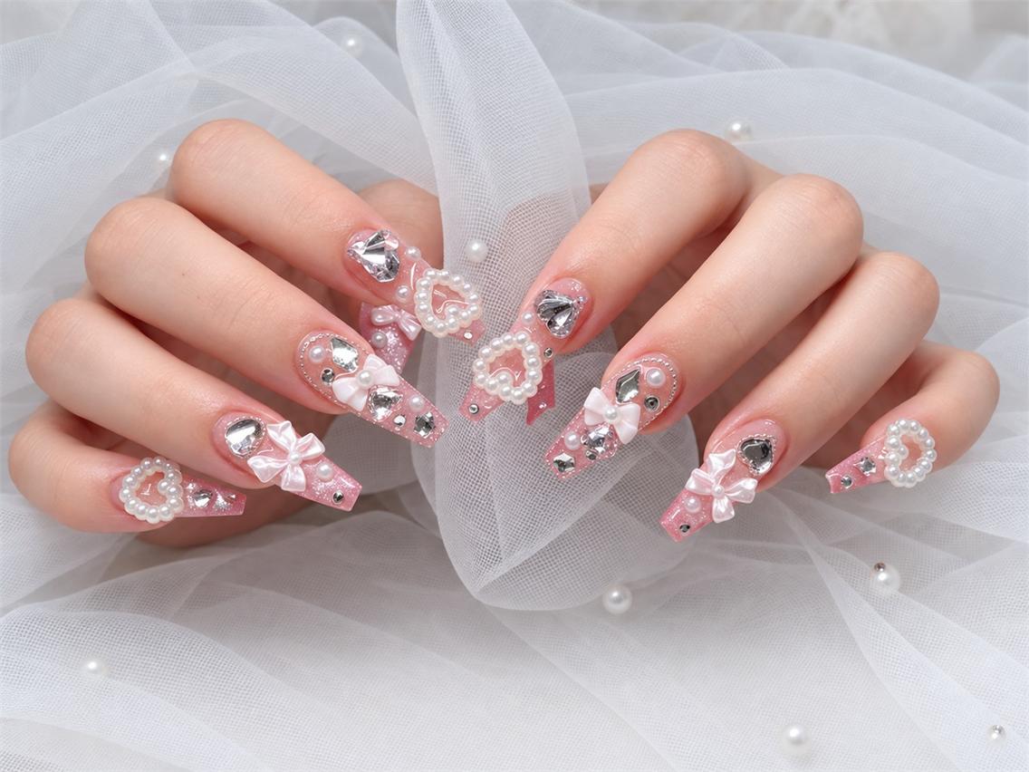 ネイル キラキラネイル ロングネイル ピンク リボン NAILS 168 大塚のネイルデザイン