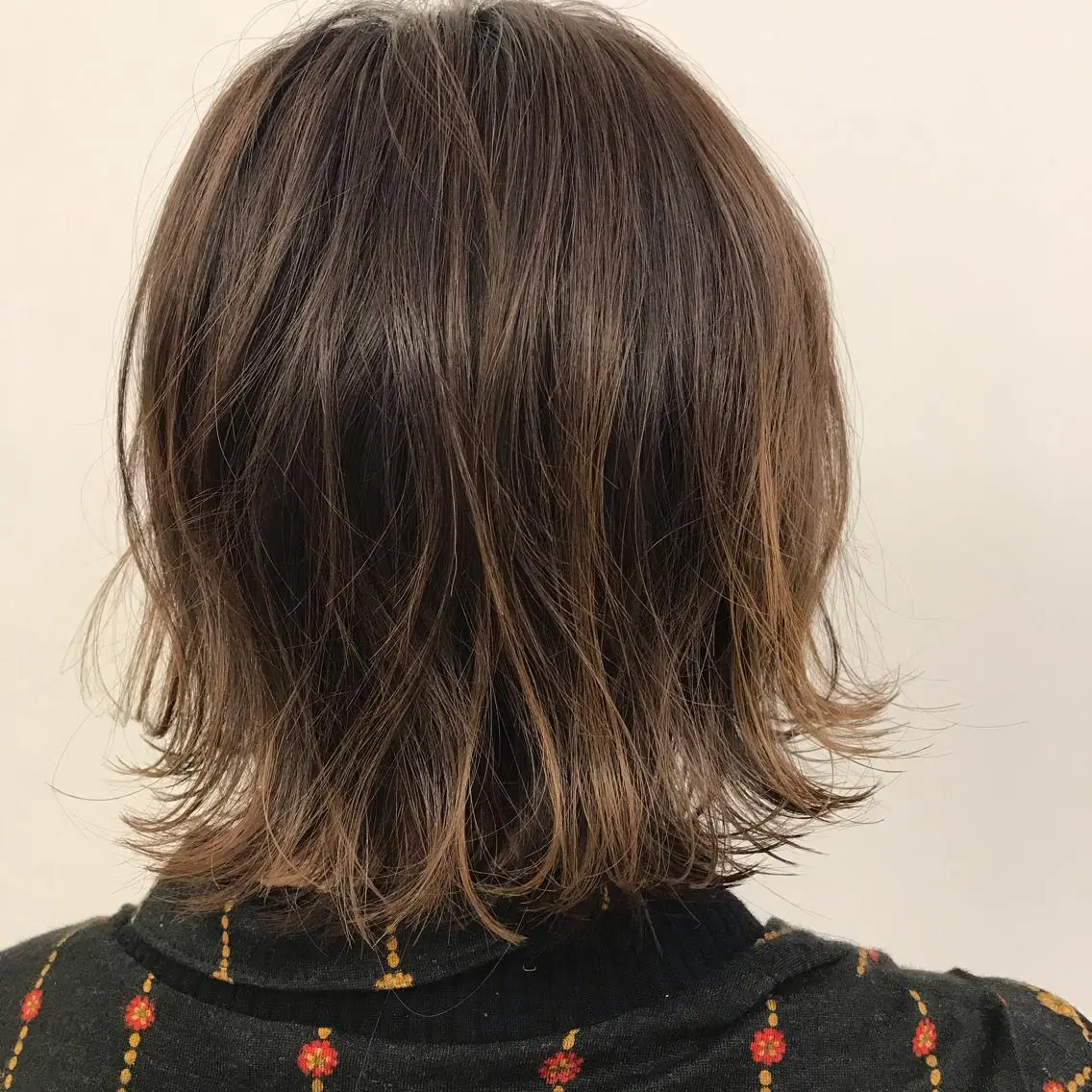 ミディアム ボブ 外ハネヘア Bonheur umedaのヘアスタイル