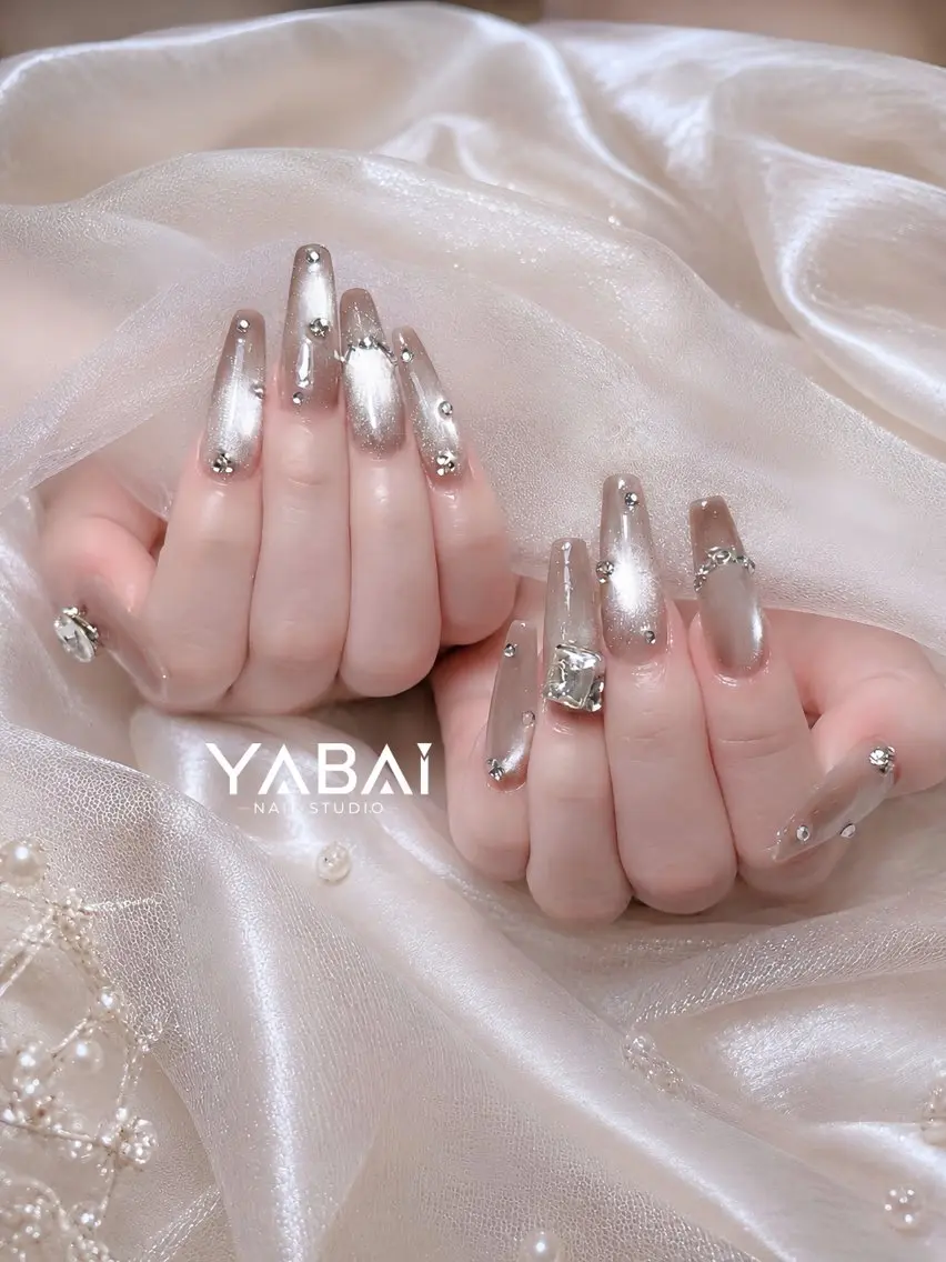 ネイル ブラウン クリアネイル キラキラネイル ロングネイル ミラーネイル YABAI NailStudioのネイルデザイン