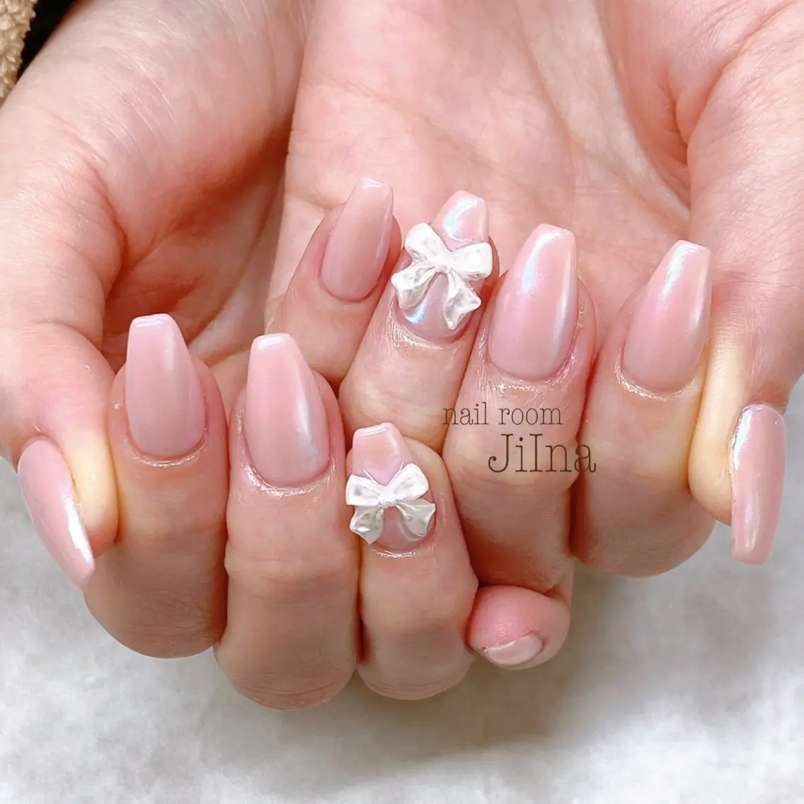 ネイル オーロラネイル ピンク リボン JiIna nailのネイルデザイン