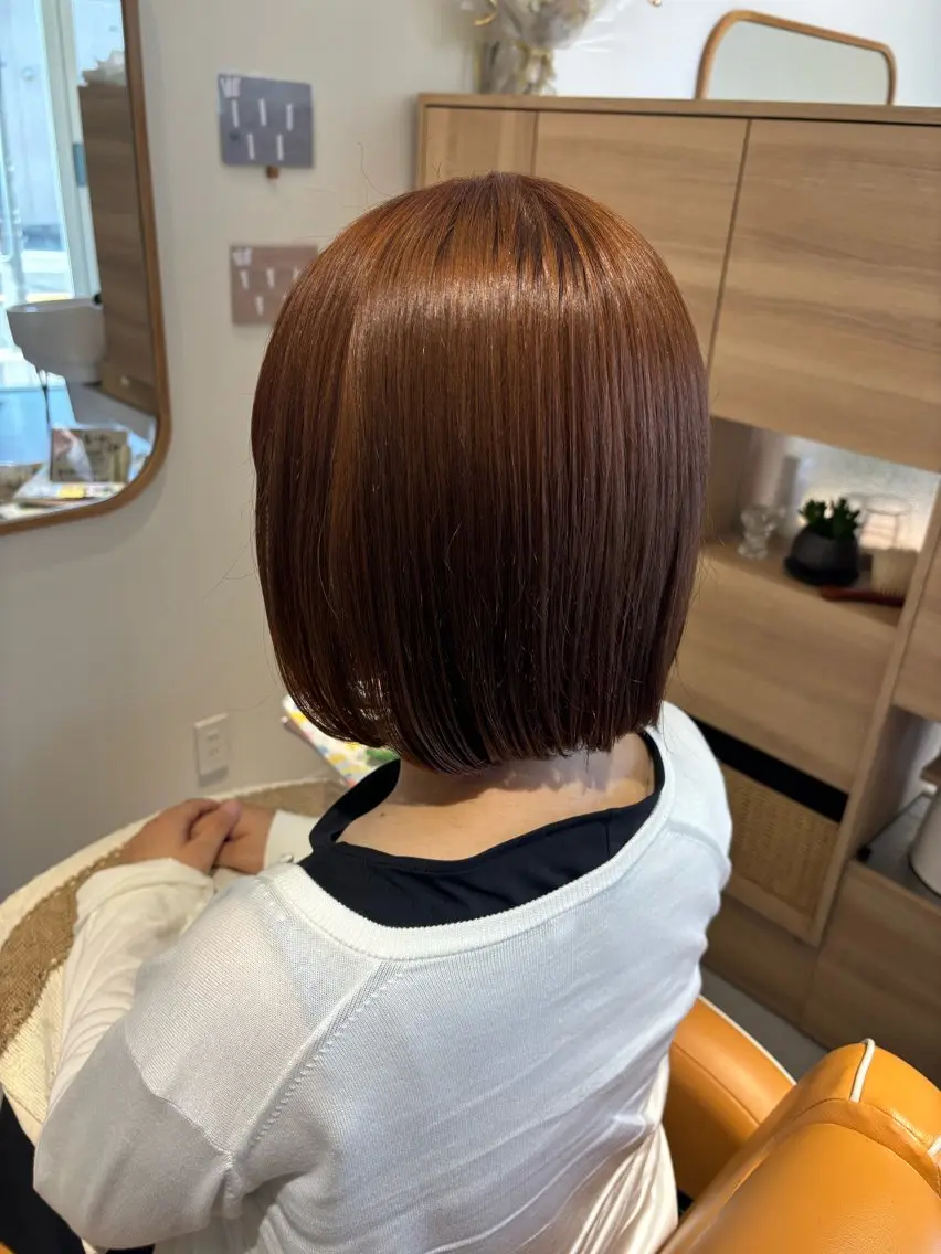 ミディアム オレンジブラウン mile 〔東二見〕のヘアスタイル