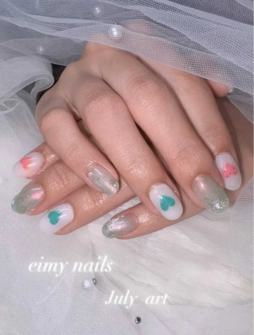 ネイル オーロラネイル フラッシュネイル グラデーション グリーン ハート ハンドネイル eimy nails♡のネイルデザイン