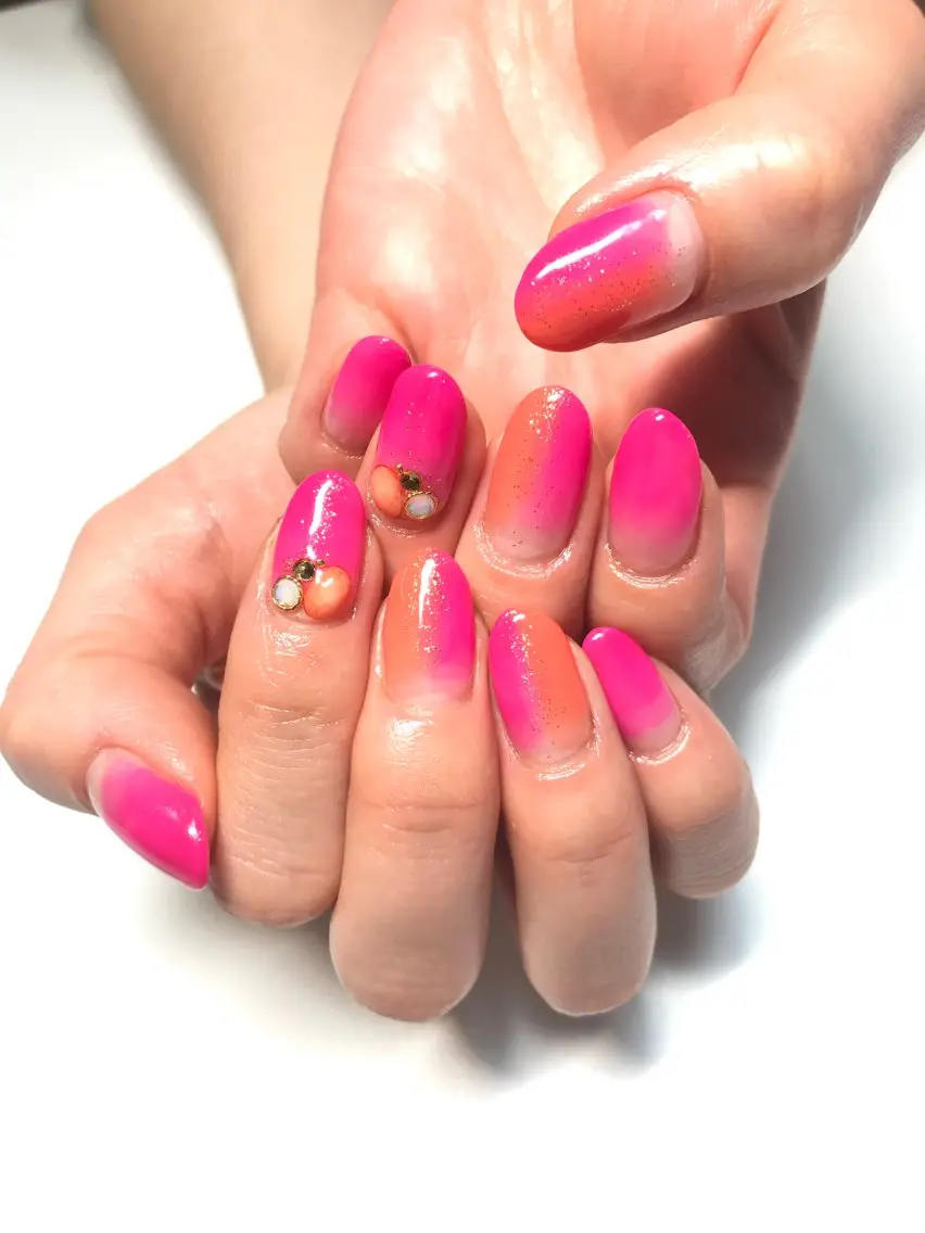 ネイル グラデーション ラメ(グリッター) オレンジ ピンク ストーンネイル Sachi NAILのネイルデザイン
