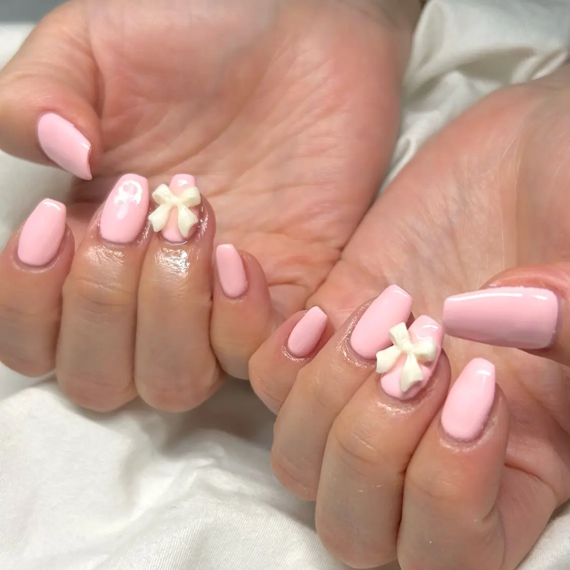 ネイル パステルネイル ピンク リボン シンプルネイル 春ネイル shine'an fuka🌿🫧のネイルデザイン