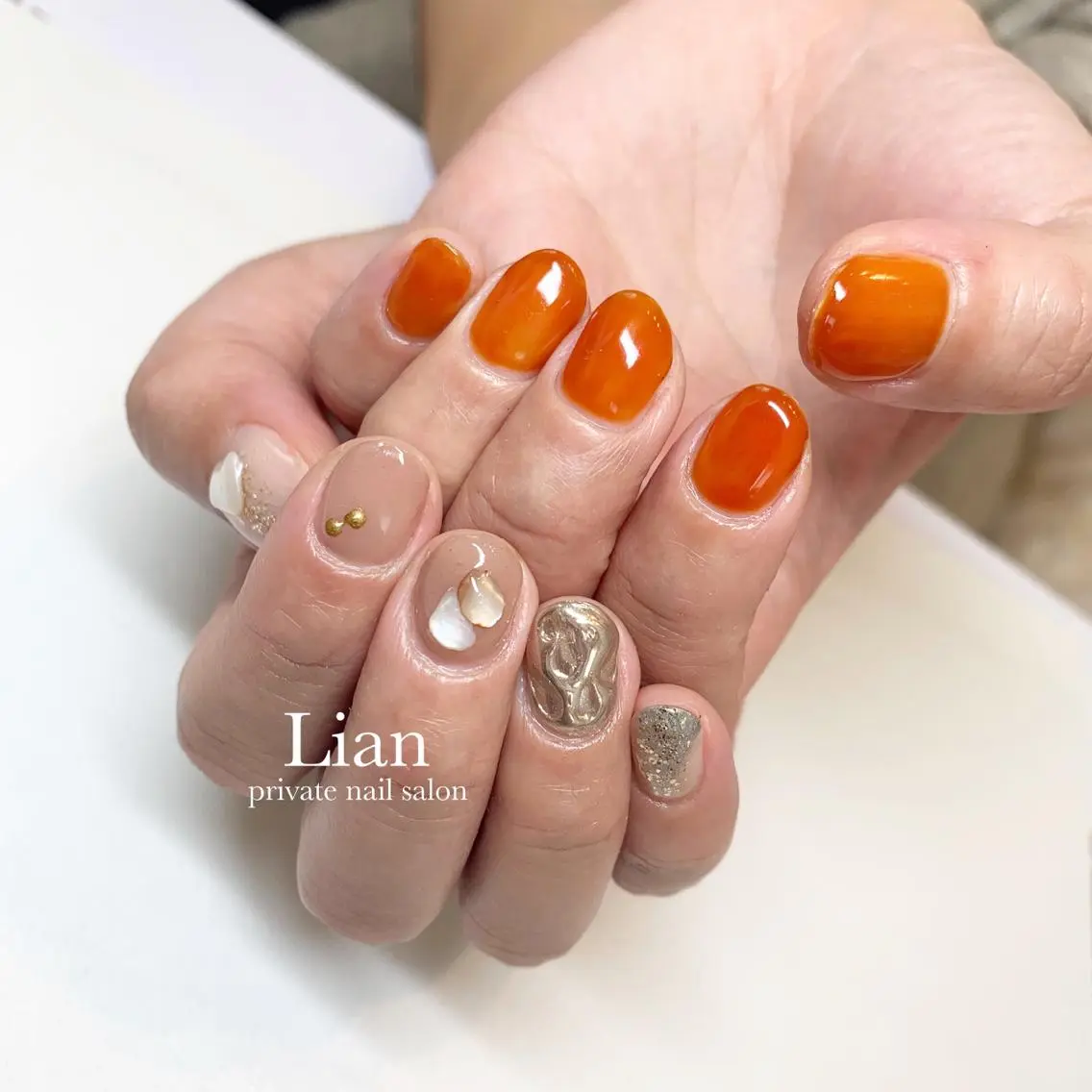ネイル ブラウン ミラーネイル オレンジ ショートネイル nailsalon Lenoaのネイルデザイン
