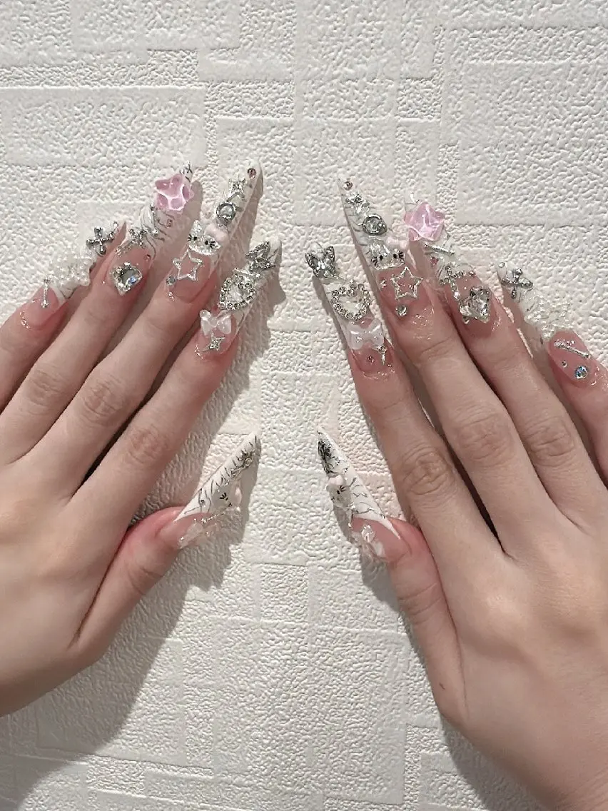 ス-パ-ロングチップスカルプ10本ア-トゴテゴテデザインの写真
