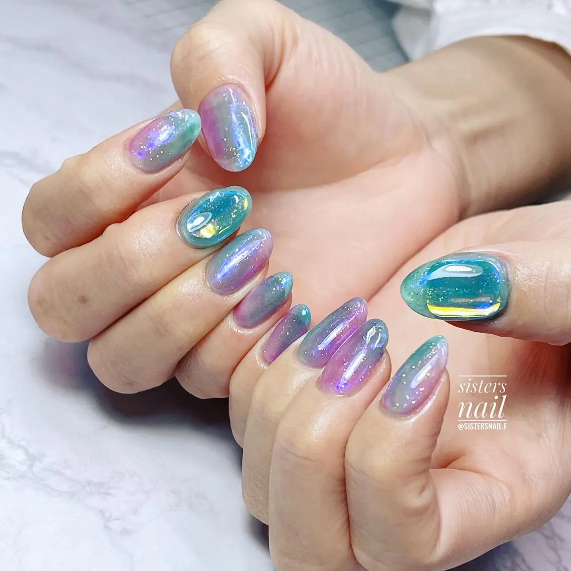 ネイル アートネイル オーロラネイル ブルー 氷ネイル・うるうるネイル キラキラネイル sisters nail.fのネイルデザイン