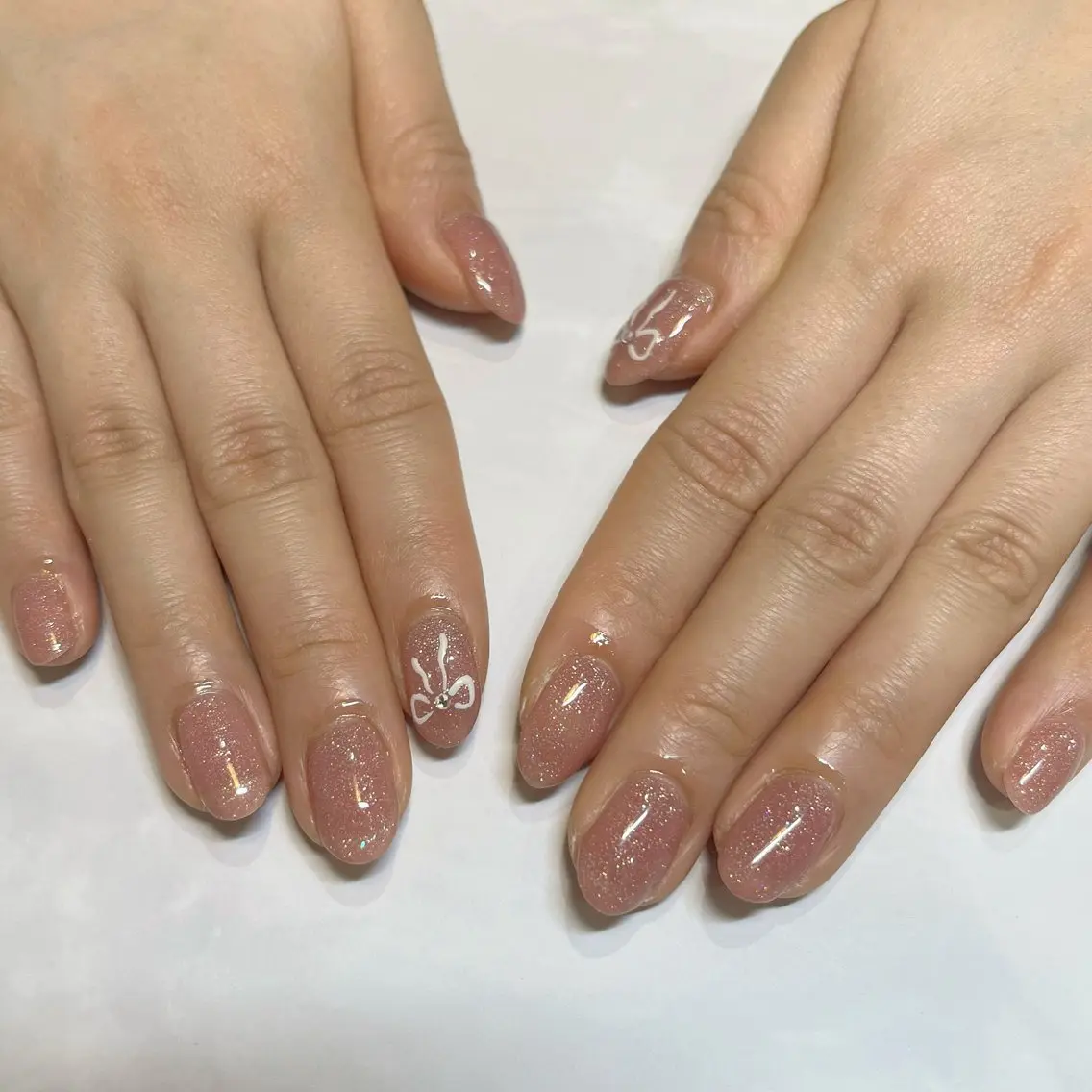 ネイル リボン REMIA 🤍 NAKANEのネイルデザイン