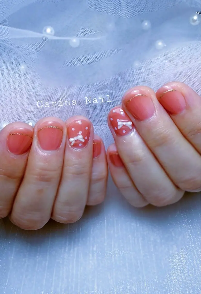 ネイル ガーリー ピンク リボン Carina Nailのネイルデザイン