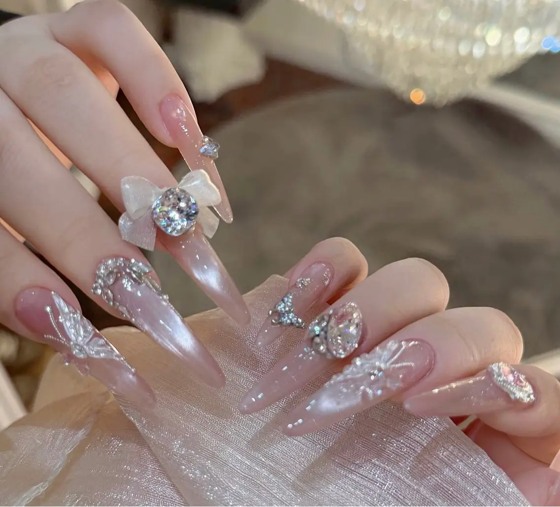 ネイル ガーリー キラキラネイル ピンク リボン Yoxie Nailのネイルデザイン