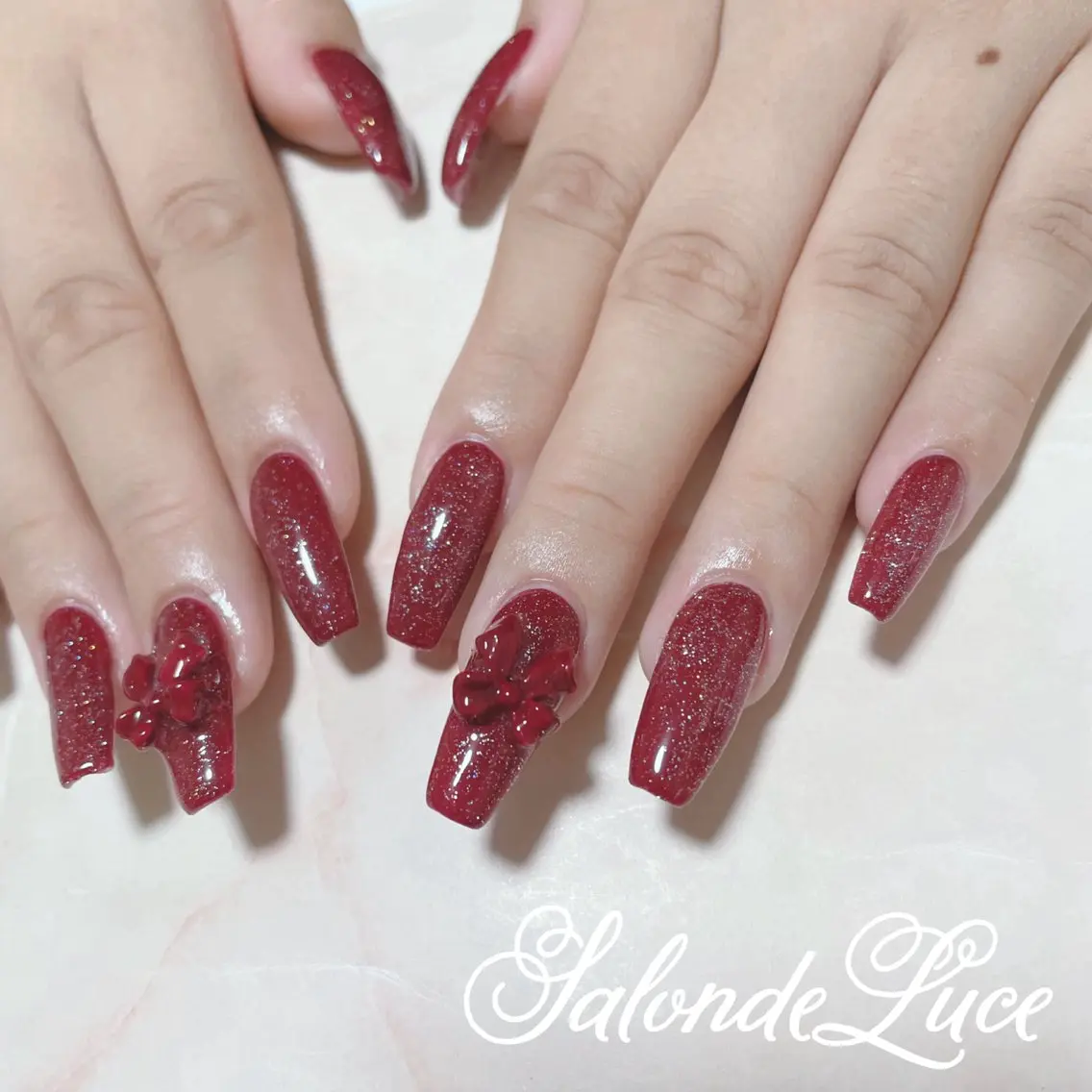 ネイル キラキラネイル リボン Salon de Luceのネイルデザイン