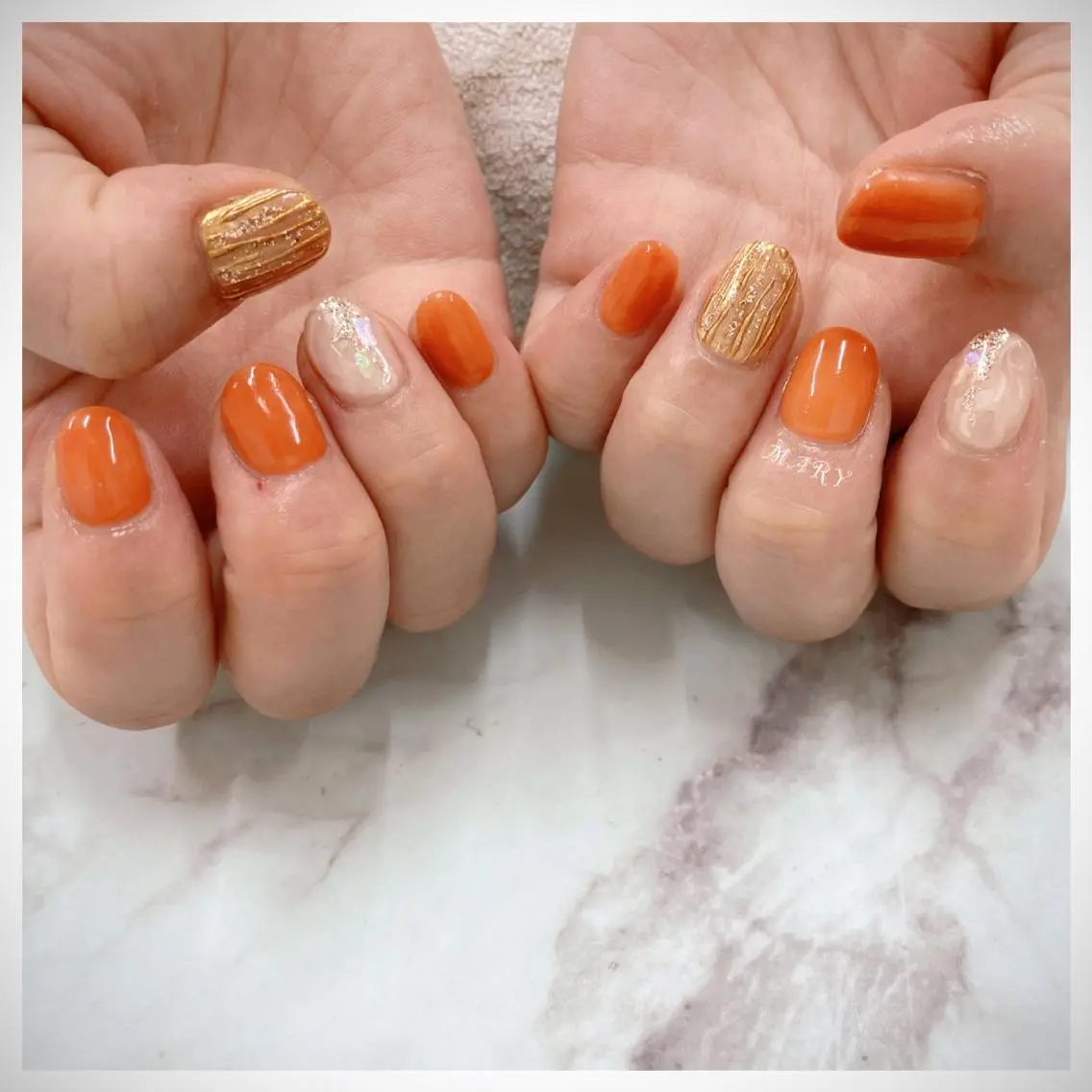 ネイル ミラーネイル ニュアンスネイル ワンカラーネイル オレンジ ハンドネイル Mary nail .narumiのネイルデザイン