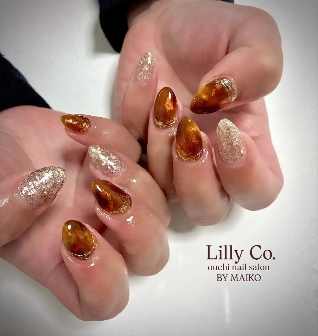 ネイル べっ甲ネイル オレンジ ハンドネイル ハンドケア Lilly Co.のネイルデザイン