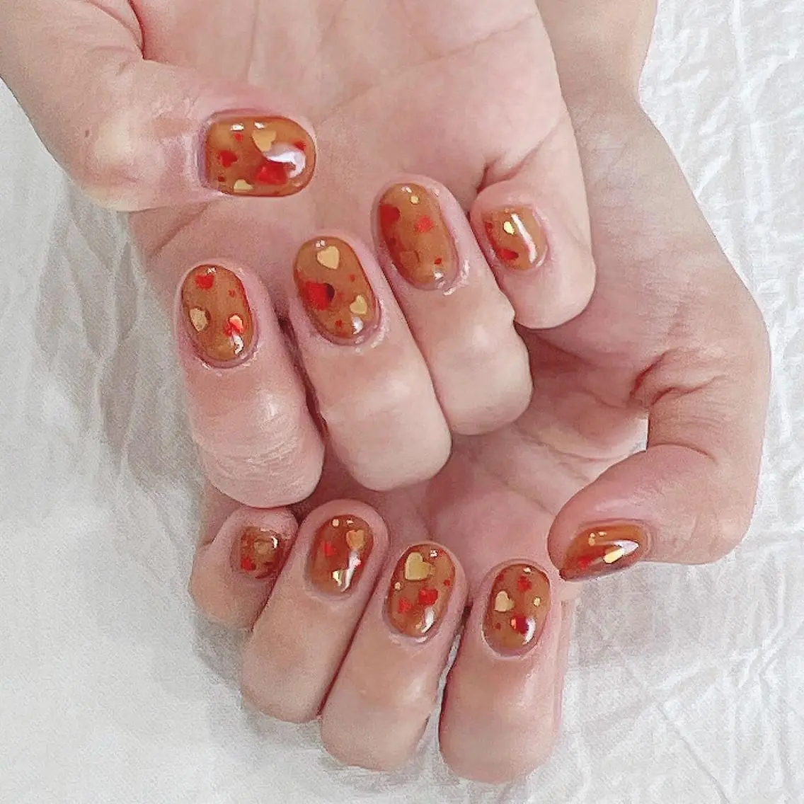 ネイル ブラウン ハート オレンジ 赤色 ハンドネイル peaberry nailのネイルデザイン