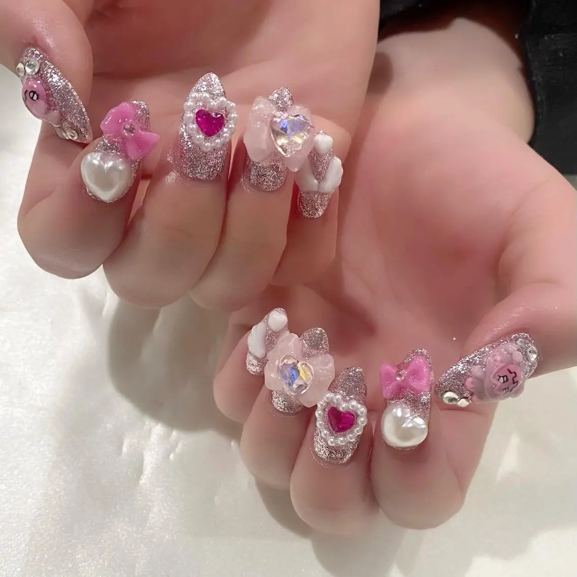 ネイル ハート ロングネイル ピンク リボン 春ネイル ハンドネイル Salon Ｋのネイルデザイン
