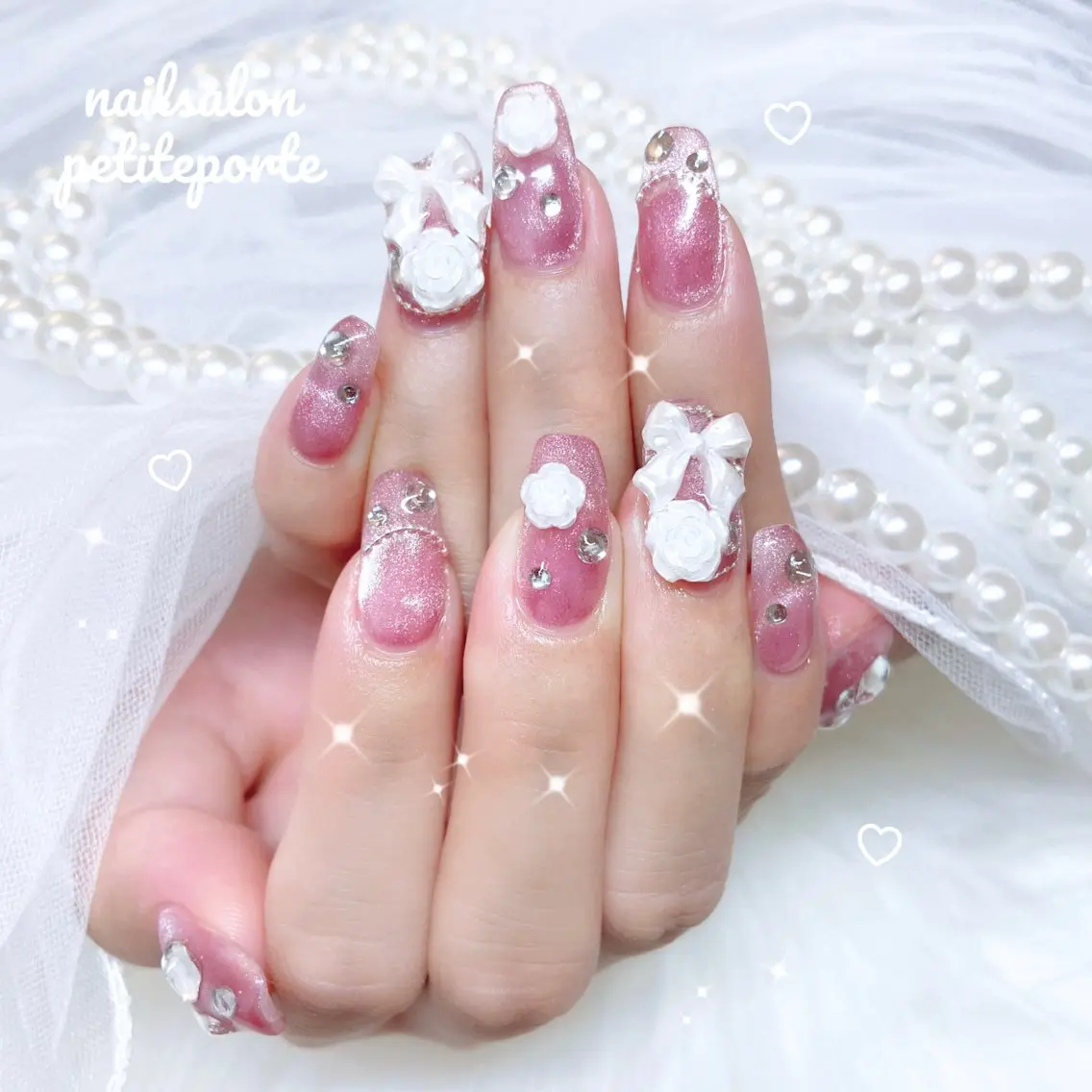 ネイル フラワーネイル キラキラネイル マグネットネイル ピンク リボン ハンドネイル petite porteのネイルデザイン