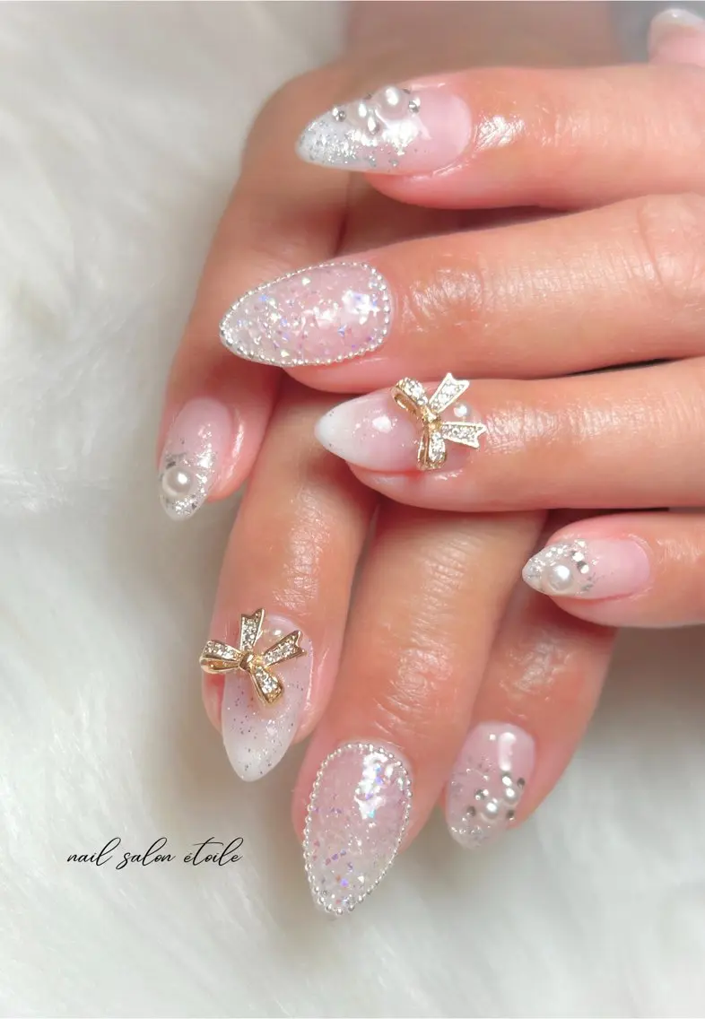 ネイル オーロラネイル ゴールド ピンク リボン ハンドネイル nail salon étoileのネイルデザイン