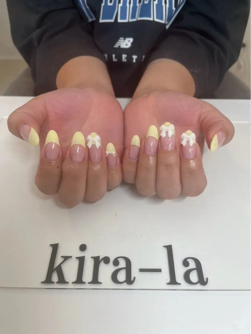 ネイル フレンチネイル リボン 黄色 kira-la キララ･:*..のネイルデザイン