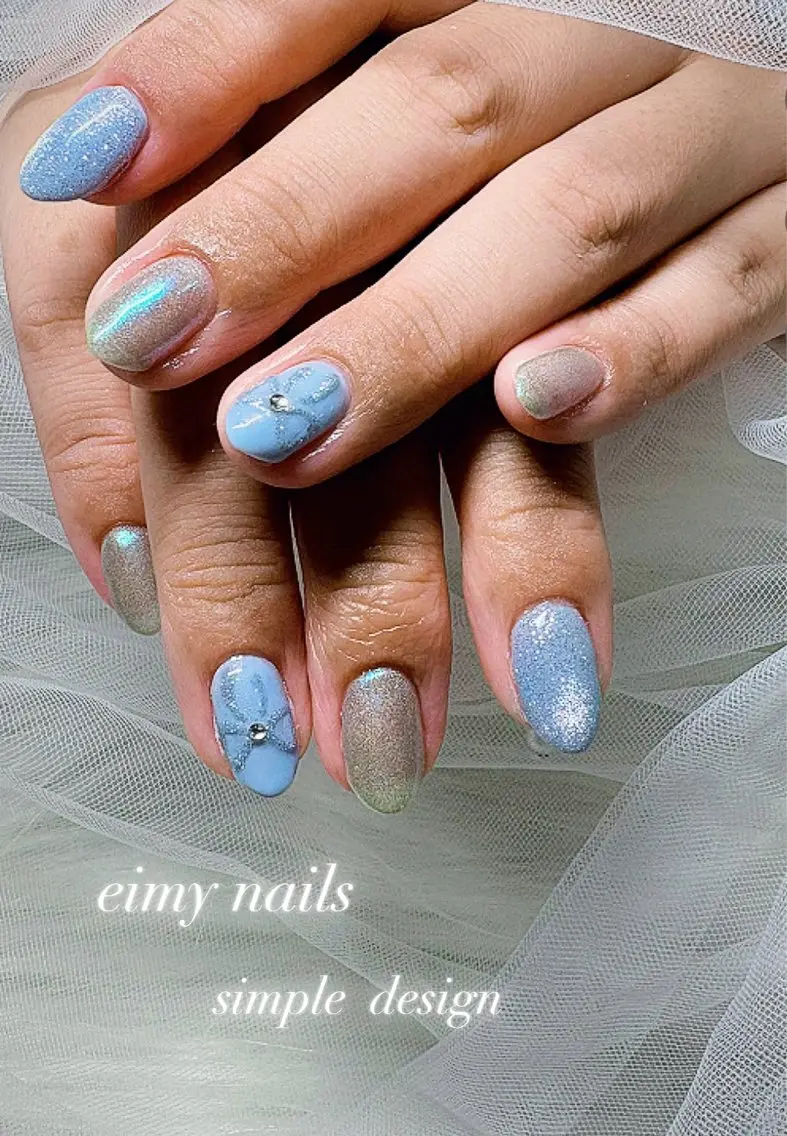 ネイル アートネイル オーロラネイル 水色 マグネットネイル リボン ハンドネイル eimy nails♡のネイルデザイン
