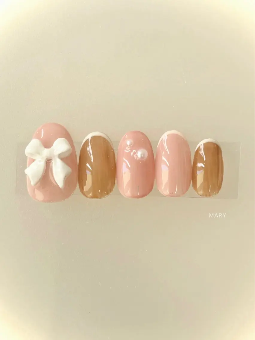 ネイル ブラウン ニュアンスネイル ピンク リボン ハンドネイル Mary nail .narumiのネイルデザイン