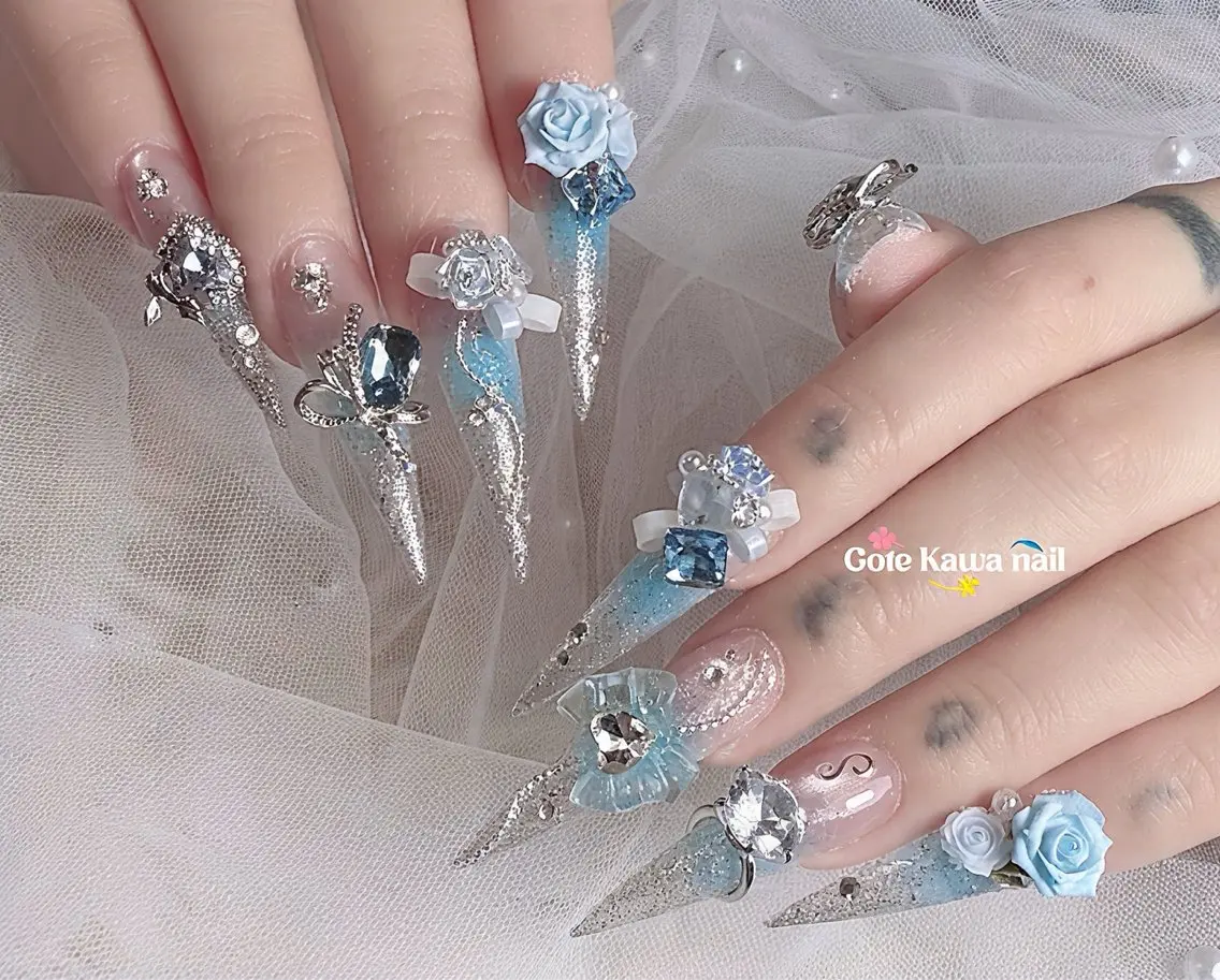 ネイル ブルー フラッシュネイル キラキラネイル 水色 リボン ハンドネイル ハンドケア Gote Kawa nail salonのネイルデザイン