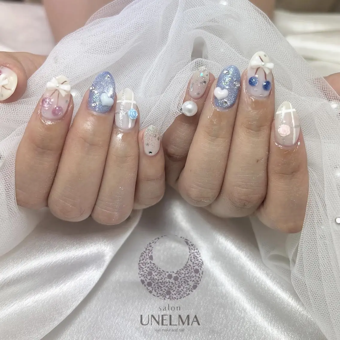 ネイル アートネイル ブルー ガーリー キラキラネイル ラメ(グリッター) ハンドネイル りとるうねるま （UNELMA）のネイルデザイン