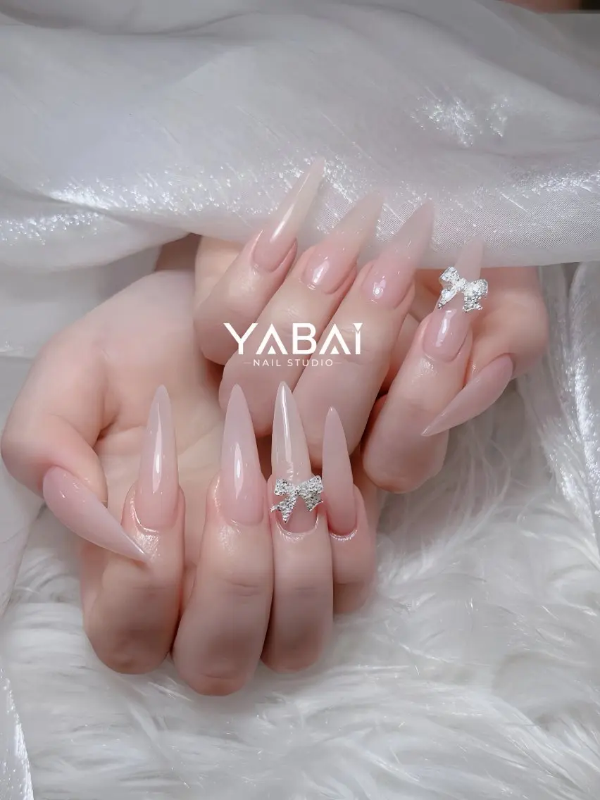 ネイル キラキラネイル ロングネイル ピンク リボン シルバー YABAI NailStudioのネイルデザイン