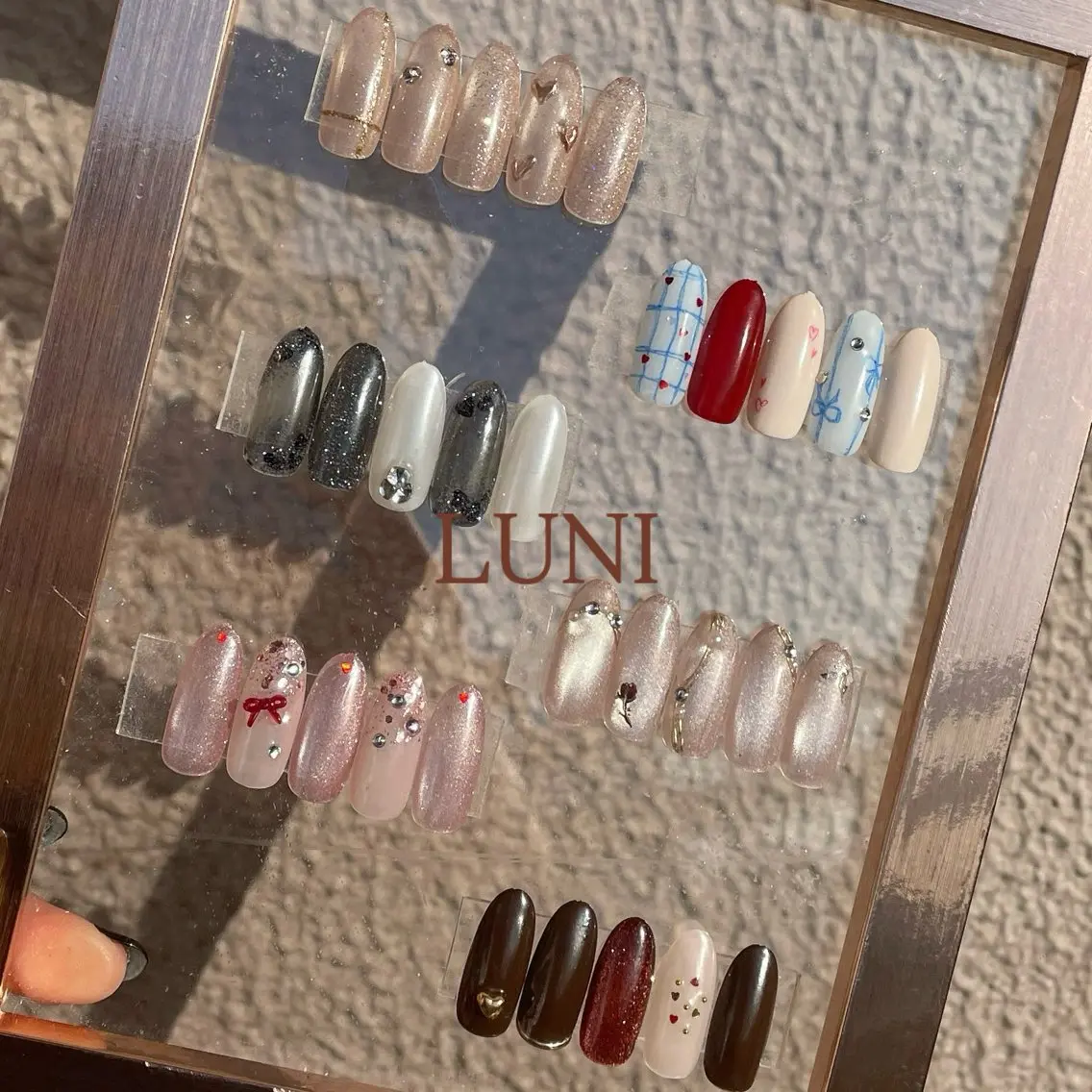 ネイル ブラウン ゴールド キラキラネイル バレンタイン ハンドネイル LUNI 久屋大通 ˚✧₊⁎/ yuriのネイルデザイン