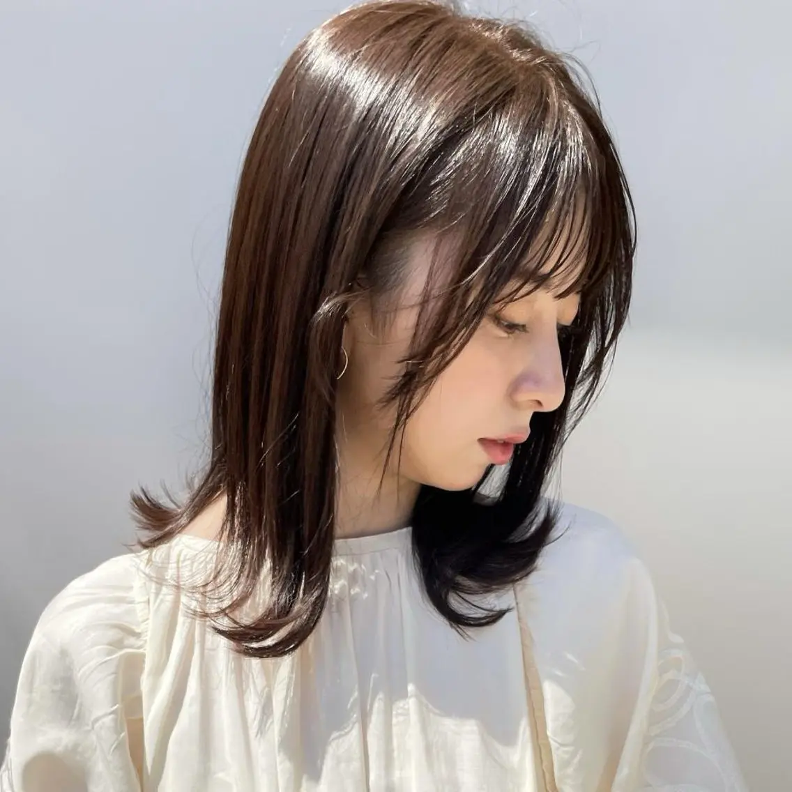 ミディアム ボブ 外ハネヘア カット ヘアカラー トリートメント Lino by hoNuaのヘアスタイル