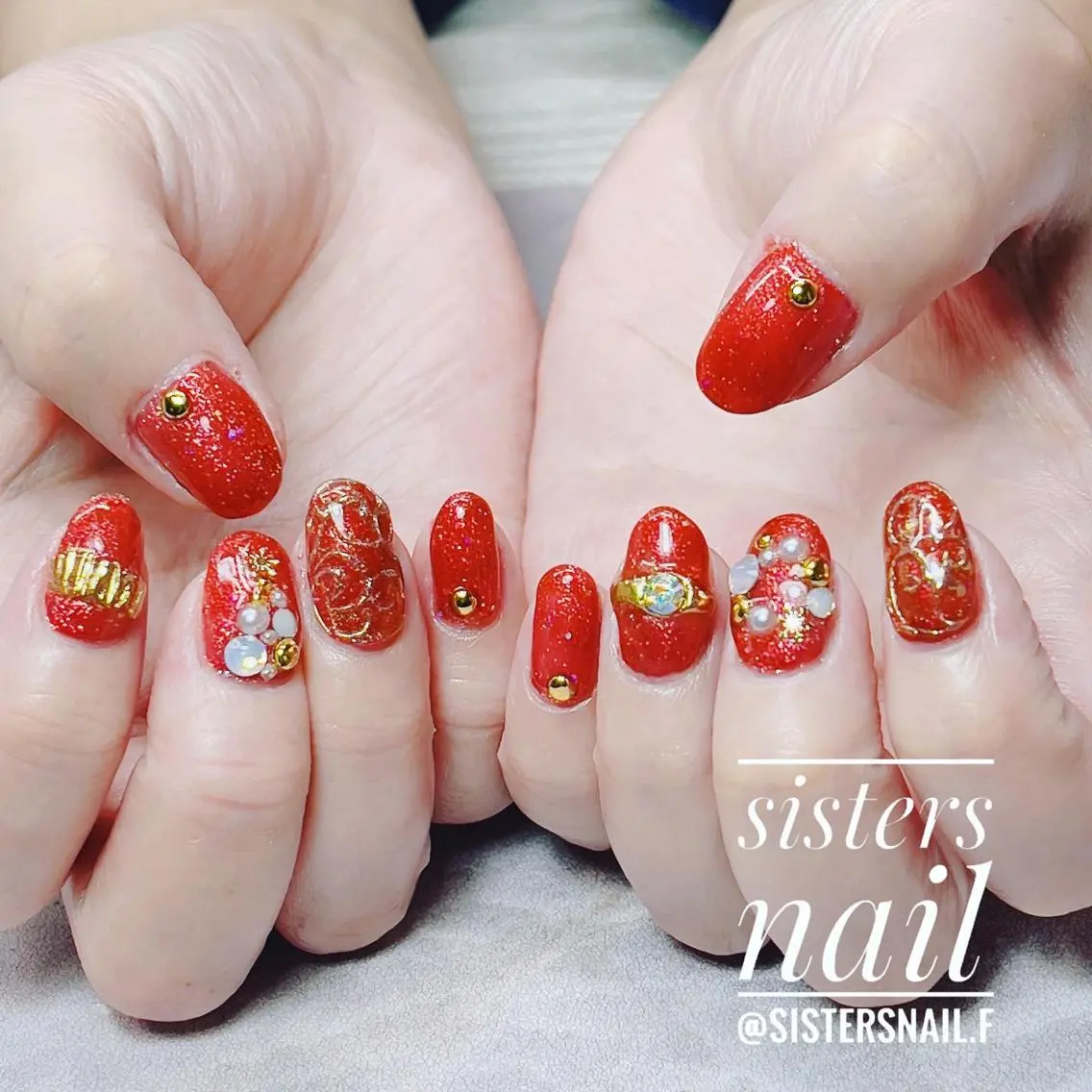 ネイル アートネイル キラキラネイル ラメ(グリッター) 赤色 冬ネイル sisters nail.fのネイルデザイン