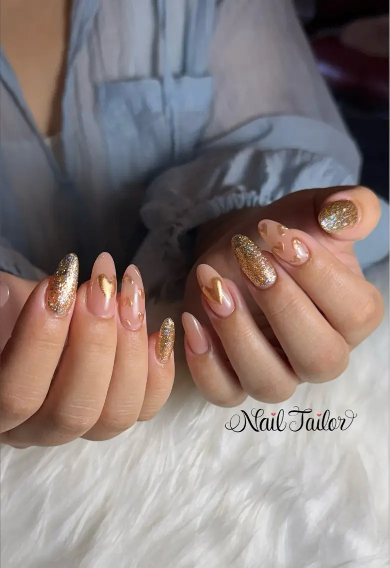 ネイル ゴールド ハート キラキラネイル ロングネイル ミラーネイル ハンドネイル NailTailor ネイルテイラーのネイルデザイン