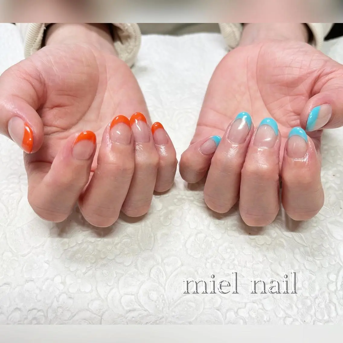 ネイル フレンチネイル 水色 オレンジ 春ネイル 夏ネイル ハンドネイル miel nailのネイルデザイン