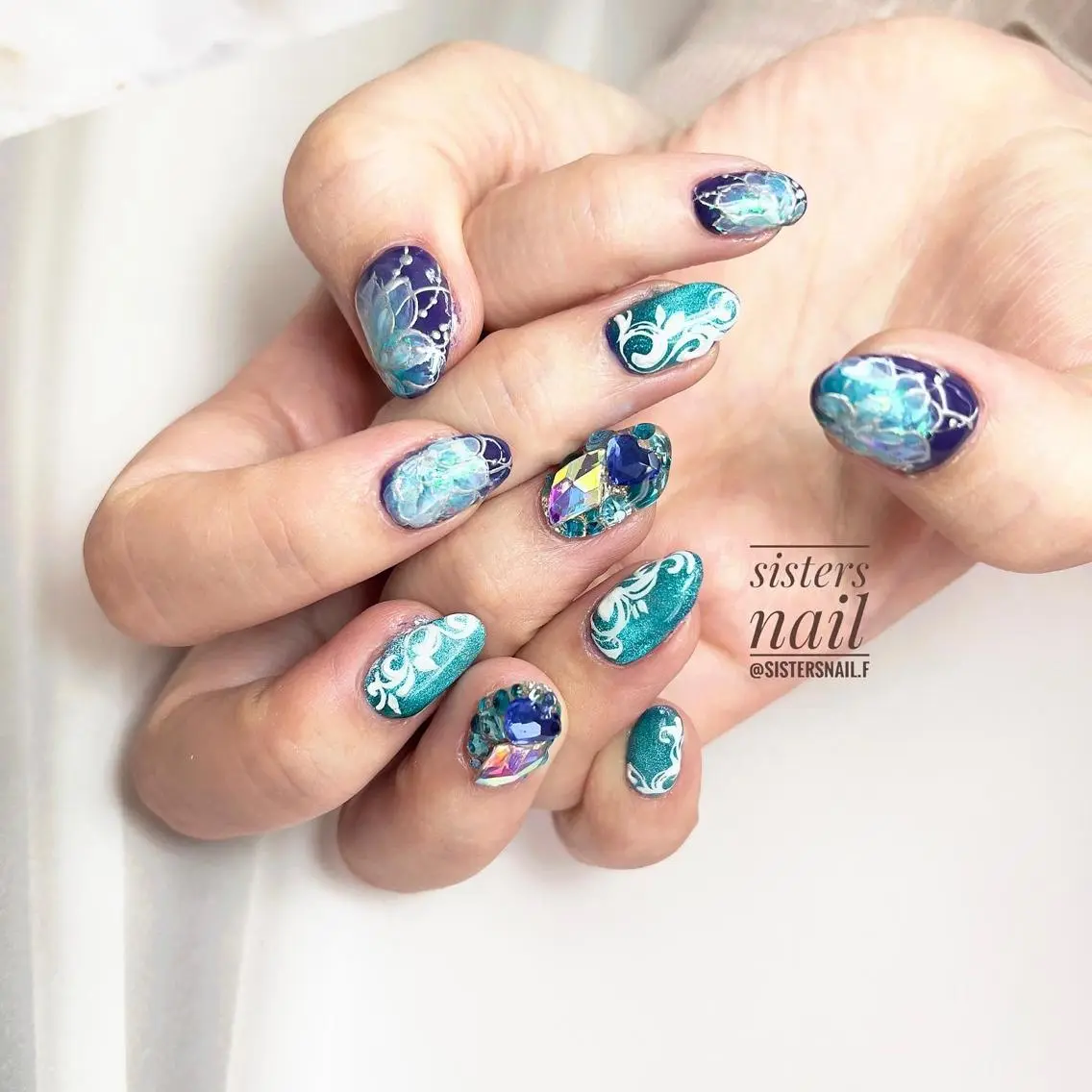 ネイル アートネイル ブルー クリアネイル フラワーネイル キラキラネイル sisters nail.fのネイルデザイン