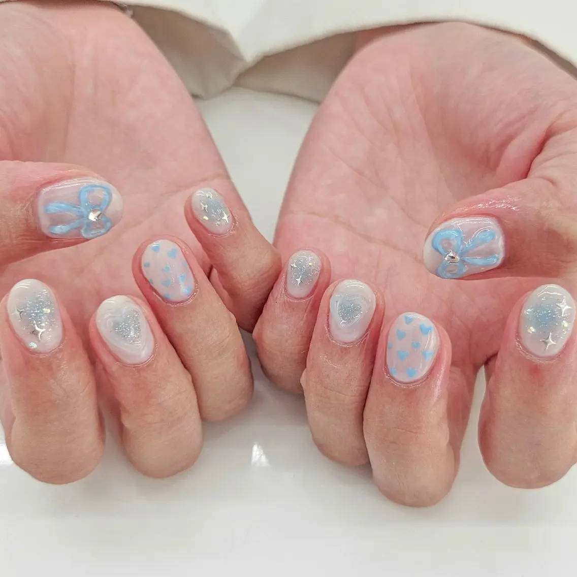 ネイル ブルー ハート リボン ハンドネイル ハンドケア Dali🌙 NATSUKIのネイルデザイン